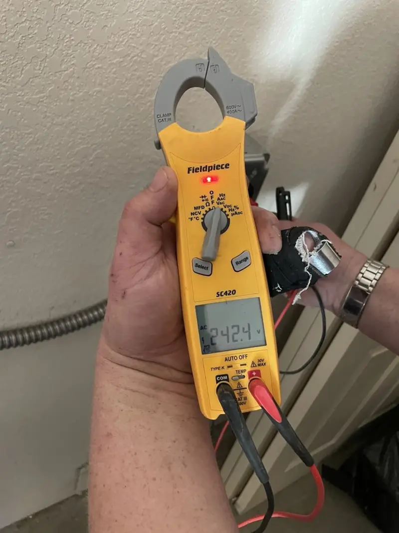 Voltage testing with clamp meter during Electrical Installation Services in Durham